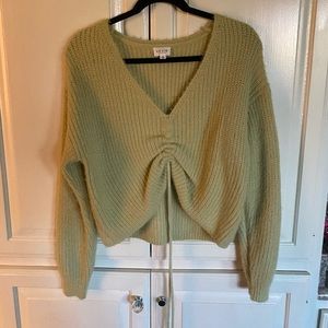 light green sweater